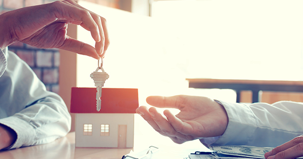 keys being handed over from letting agent to tenant